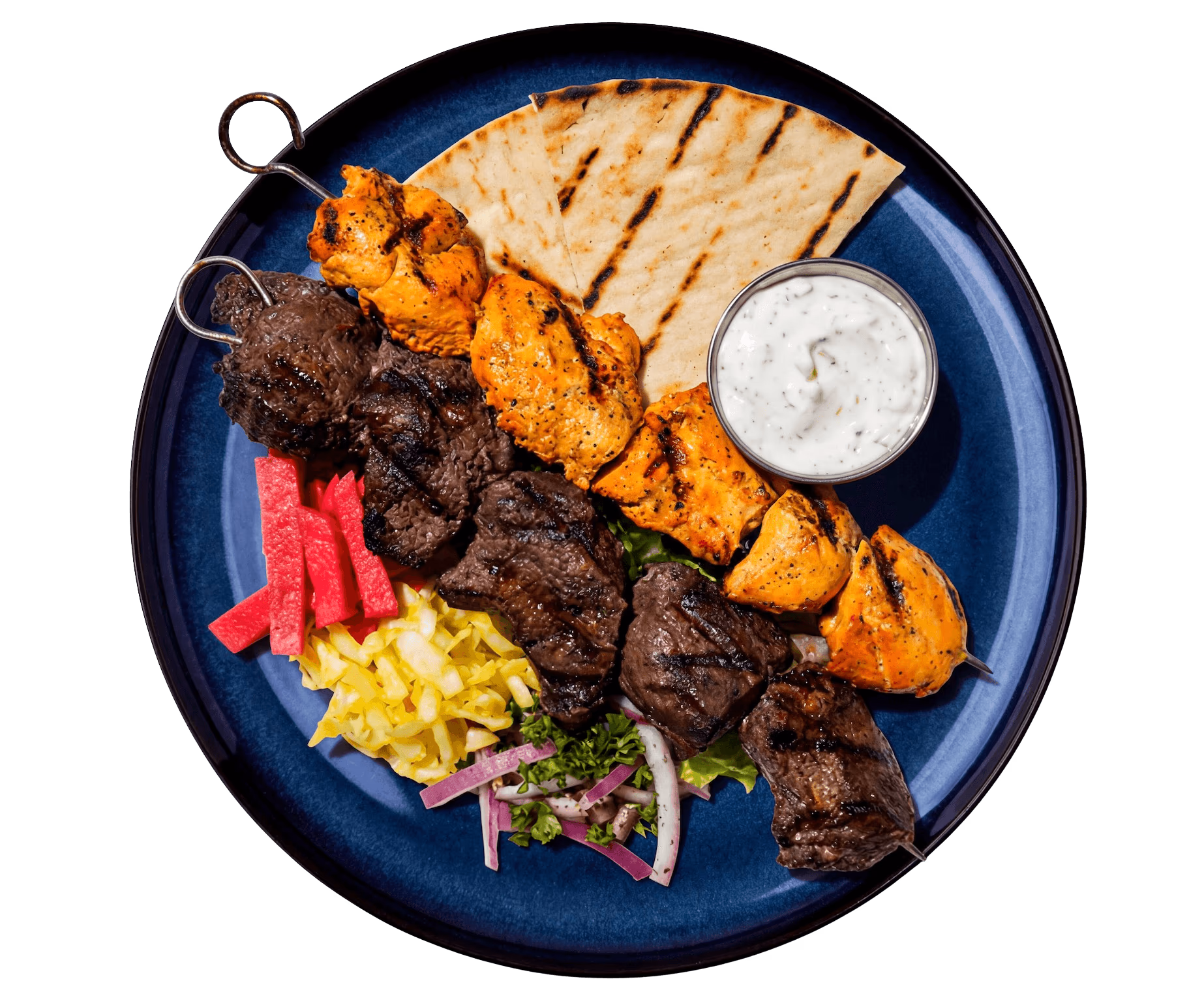 Mediterranean chicken and beef kebab platter with pita and tzatziki